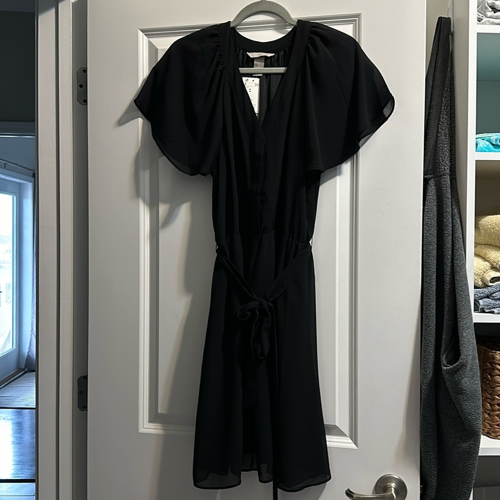 Lightweight flowing little black dress. Never worn.